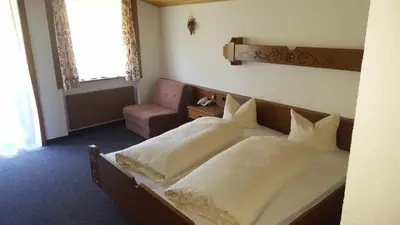 Ein Bett oder Betten in einem Zimmer der Unterkunft Hotel Garni
