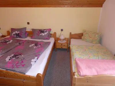 Ein Bett oder Betten in einem Zimmer der Unterkunft Gästehaus Zussner