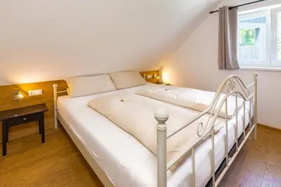 Ein Bett oder Betten in einem Zimmer der Unterkunft Ferienhaus Bachschlössle