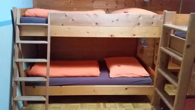 Ein Etagenbett oder Etagenbetten in einem Zimmer der Unterkunft Klausberg-Hütte