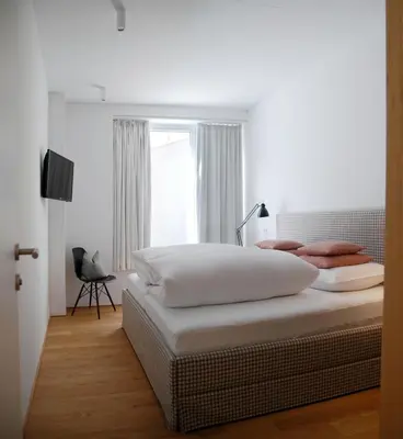 Ein Bett oder Betten in einem Zimmer der Unterkunft Pension Alpenfluh