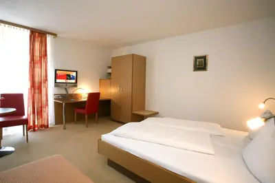 Ein Bett oder Betten in einem Zimmer der Unterkunft Hotel Bischof