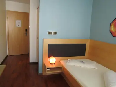 Ein Bett oder Betten in einem Zimmer der Unterkunft Businesshotel Valerian