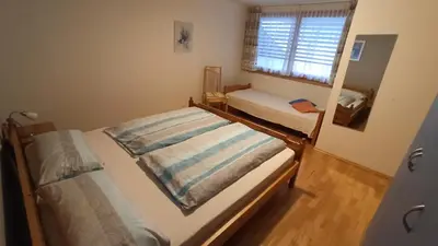 Ein Bett oder Betten in einem Zimmer der Unterkunft Gästehaus Lutz