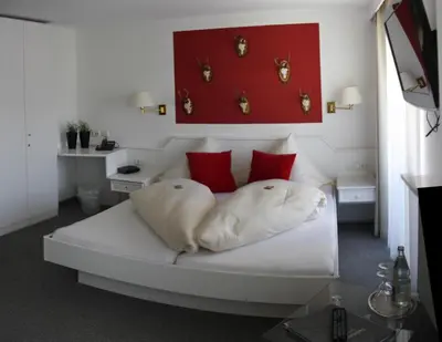 Ein Bett oder Betten in einem Zimmer der Unterkunft Hotel-Garni Fels