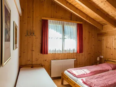 Ein Bett oder Betten in einem Zimmer der Unterkunft Ferienhaus Valleu