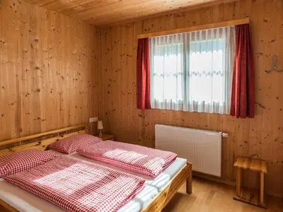 Ein Bett oder Betten in einem Zimmer der Unterkunft Ferienhaus Valleu