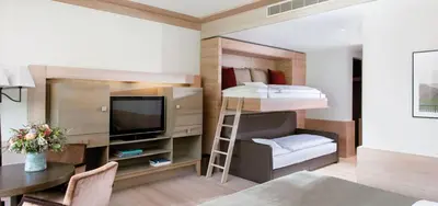 Ein Bett oder Betten in einem Zimmer der Unterkunft A-ROSA Ifen Hotel Kleinwalsertal