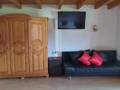 Ein Sitzbereich in der Unterkunft Ferienwohnungen Pension Sonnblick