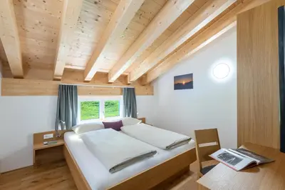 Ein Bett oder Betten in einem Zimmer der Unterkunft Rössle Appartements und Sport Rössle Skiverleih & Sportgeschäft