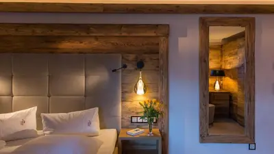 Ein Bett oder Betten in einem Zimmer der Unterkunft Alpine Lifestyle Berghotel Madlener