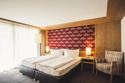 Ein Bett oder Betten in einem Zimmer der Unterkunft Hotel Hubertus - Au Bregenzerwald