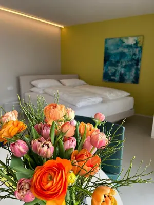 Ein Bett oder Betten in einem Zimmer der Unterkunft Seeblick Appartements Henle