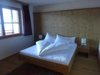 Ein Bett oder Betten in einem Zimmer der Unterkunft Ferienwohnung Oberdamüls