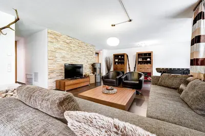 Ein Sitzbereich in der Unterkunft Gartenferienwohnung Ski In by A-Appartments