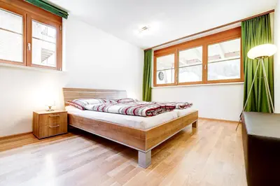 Ein Bett oder Betten in einem Zimmer der Unterkunft Gartenferienwohnung Ski In by A-Appartments