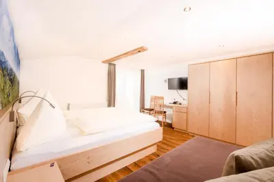 Ein Bett oder Betten in einem Zimmer der Unterkunft Hotel Garni Krumbach