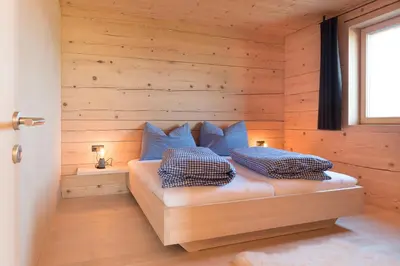 Ein Bett oder Betten in einem Zimmer der Unterkunft Ferienwohnung Wertvollholzhaus