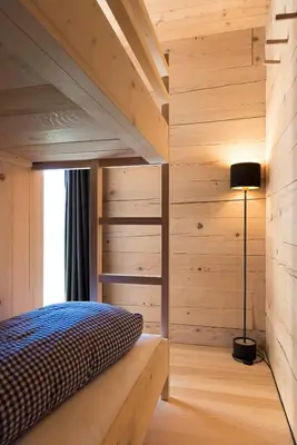 Ein Bett oder Betten in einem Zimmer der Unterkunft Ferienwohnung Wertvollholzhaus