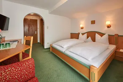 Ein Bett oder Betten in einem Zimmer der Unterkunft Pension Bergland