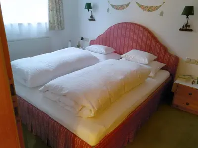 Ein Bett oder Betten in einem Zimmer der Unterkunft Hubertusklause