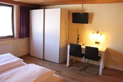 Ein Bett oder Betten in einem Zimmer der Unterkunft Katharinahof Ferienpension