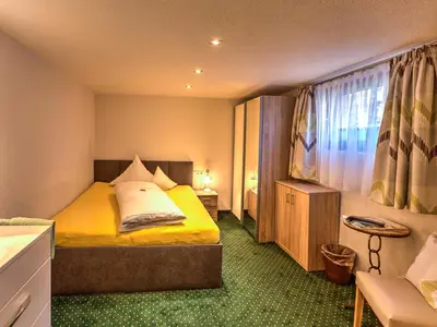 Ein Bett oder Betten in einem Zimmer der Unterkunft Pension Walserheim