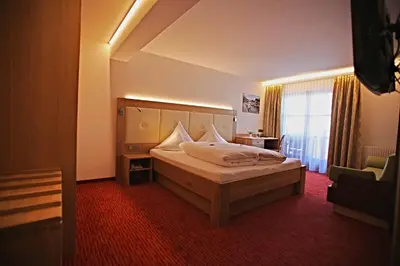Ein Bett oder Betten in einem Zimmer der Unterkunft Pension Walserheim