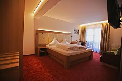 Ein Bett oder Betten in einem Zimmer der Unterkunft Pension Walserheim