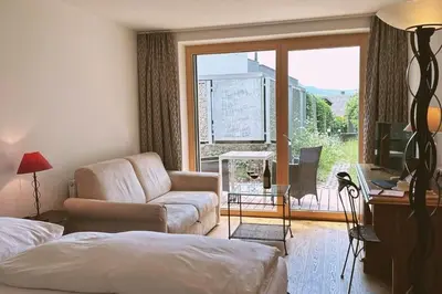 Ein Bett oder Betten in einem Zimmer der Unterkunft Hotel Daneu
