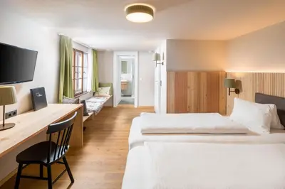 Ein Bett oder Betten in einem Zimmer der Unterkunft Hotel Sonne
