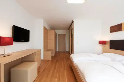 Ein Bett oder Betten in einem Zimmer der Unterkunft Sternen Hotel Wolfurt