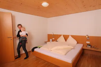 Ein Bett oder Betten in einem Zimmer der Unterkunft Sonne Bezau - Familotel Bregenzerwald