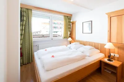 Ein Bett oder Betten in einem Zimmer der Unterkunft Ferienwohnungen & Chalets Capricorno