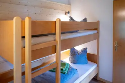 Ein Bett oder Betten in einem Zimmer der Unterkunft Haus Alpina