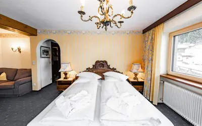 Ein Bett oder Betten in einem Zimmer der Unterkunft Hotel Olympia
