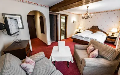 Ein Bett oder Betten in einem Zimmer der Unterkunft Hotel Olympia