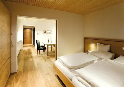 Ein Bett oder Betten in einem Zimmer der Unterkunft Das Tannberg