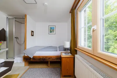 Ein Bett oder Betten in einem Zimmer der Unterkunft Gasthaus Moosegg