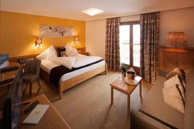 Ein Bett oder Betten in einem Zimmer der Unterkunft Hotel & Chalet Montana