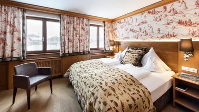 Ein Bett oder Betten in einem Zimmer der Unterkunft Hotel & Chalet Montana