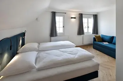 Ein Bett oder Betten in einem Zimmer der Unterkunft Krone Hard - self check-in