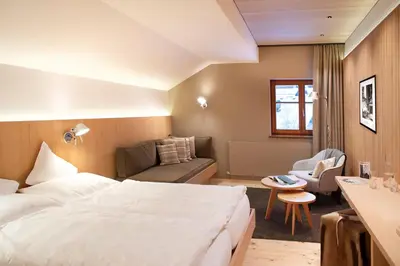 Ein Bett oder Betten in einem Zimmer der Unterkunft Alpina Lech - Geborgen in den Bergen