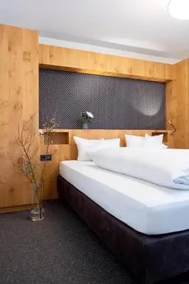 Ein Bett oder Betten in einem Zimmer der Unterkunft Valschena Appartements