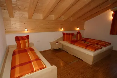 Ein Bett oder Betten in einem Zimmer der Unterkunft Alpina Appartements