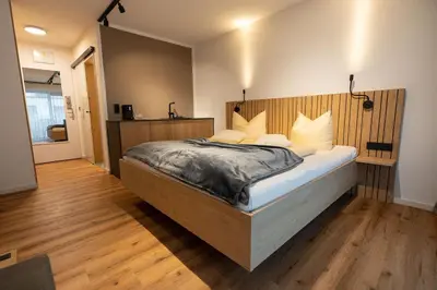 Ein Bett oder Betten in einem Zimmer der Unterkunft Haller's Posthotel