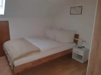 Ein Bett oder Betten in einem Zimmer der Unterkunft Ferienwohnung Gmeiner