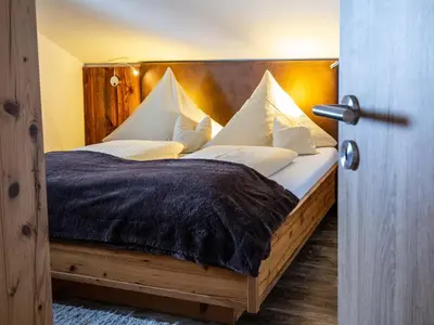 Ein Bett oder Betten in einem Zimmer der Unterkunft Adlernest