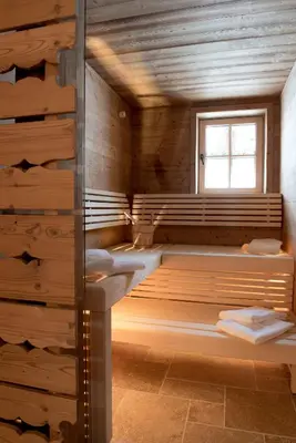 Ein Bett oder Betten in einem Zimmer der Unterkunft Lech Lodge - LEGENDARY