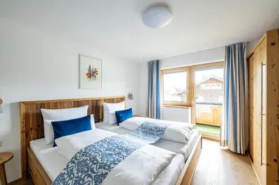 Ein Bett oder Betten in einem Zimmer der Unterkunft Haus Tannberg